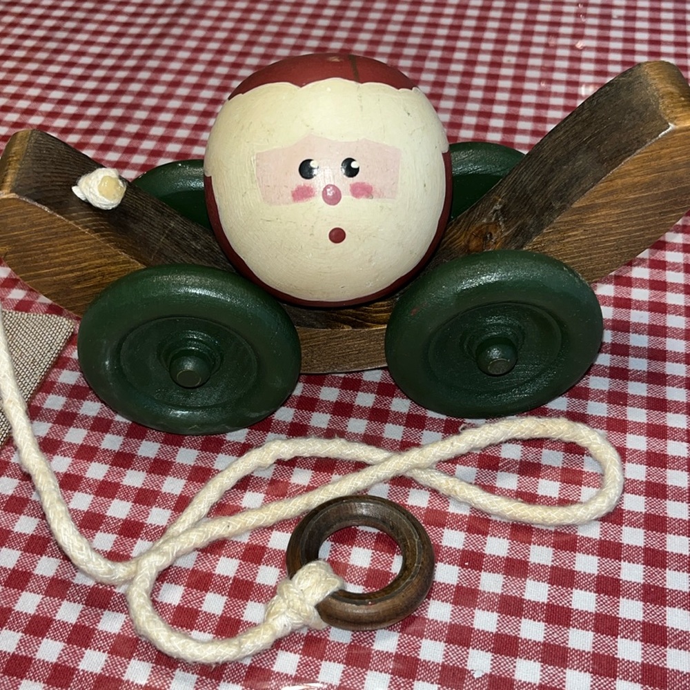 Vintage folk art Santa pull toy.